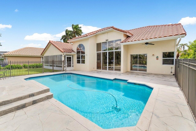 view of pool featuring ceiling fan and a patio area