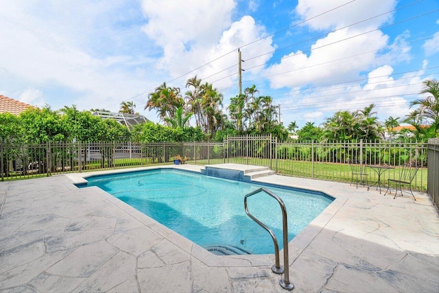 view of swimming pool with a patio area