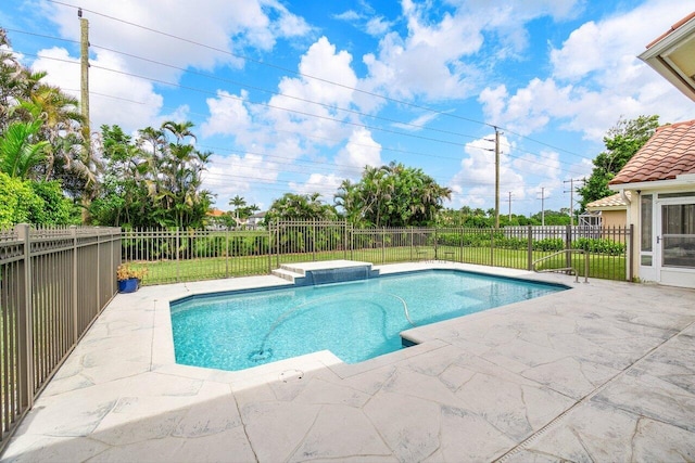 view of swimming pool with a patio area