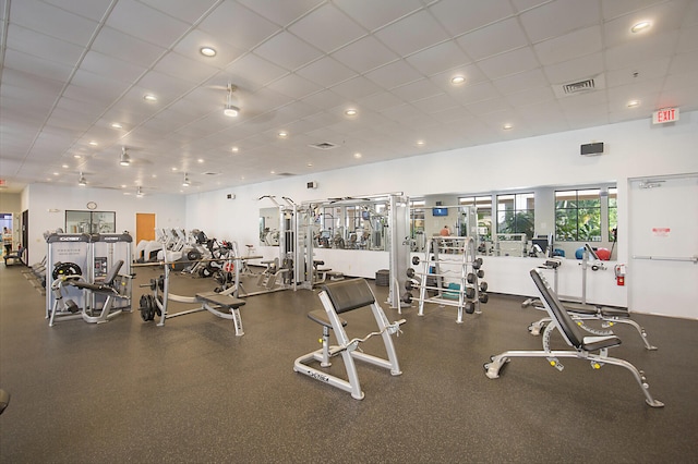 exercise room with a drop ceiling