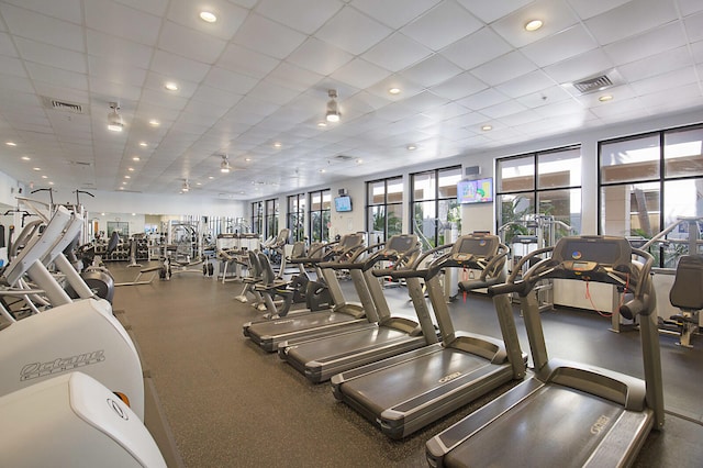 gym featuring a drop ceiling