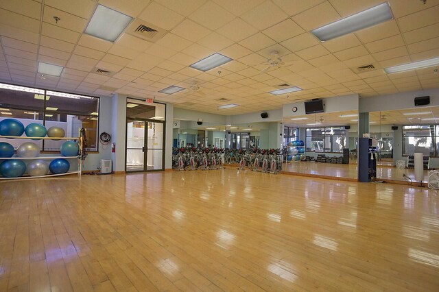 gym with hardwood / wood-style flooring