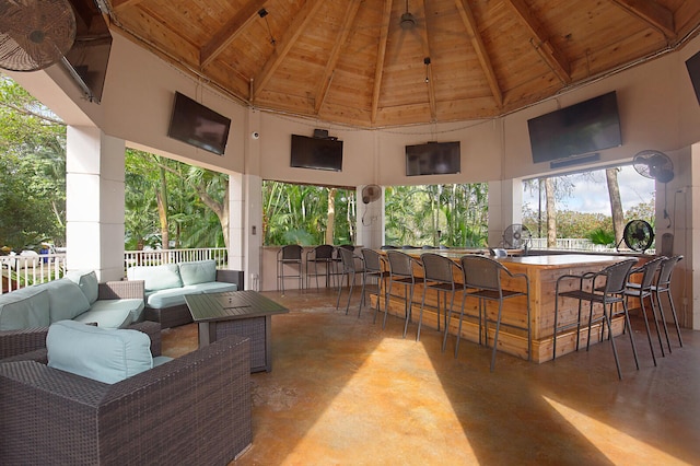 view of patio with an outdoor hangout area, a gazebo, and exterior bar