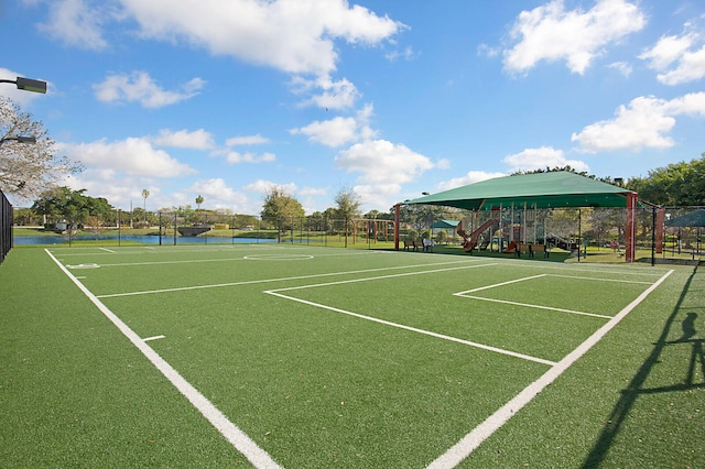 surrounding community with tennis court and a playground