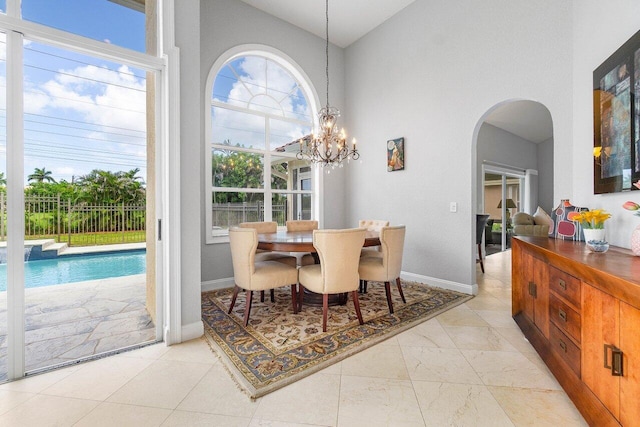 dining area featuring a notable chandelier