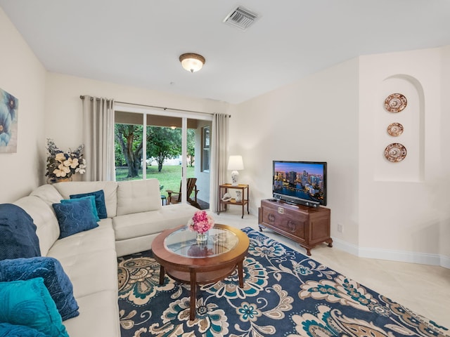 living room with tile patterned floors