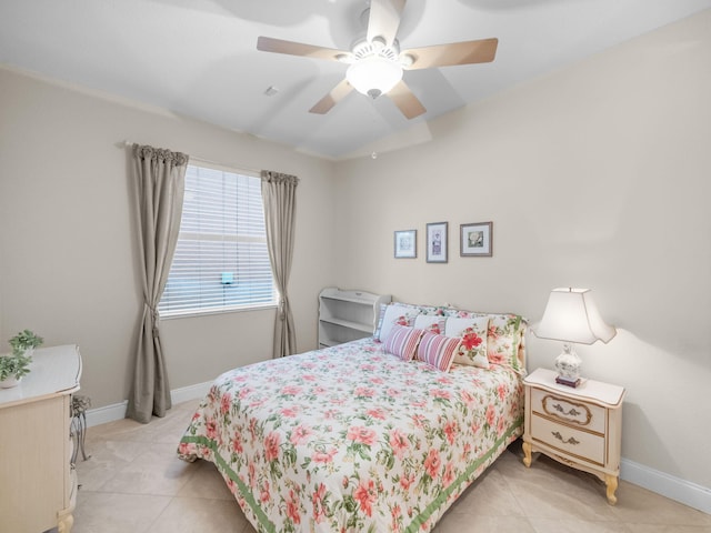 bedroom with light tile patterned floors and ceiling fan