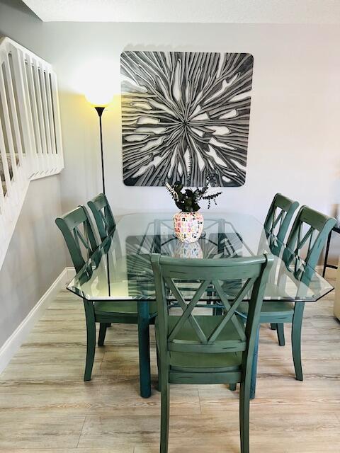 dining area with light hardwood / wood-style flooring