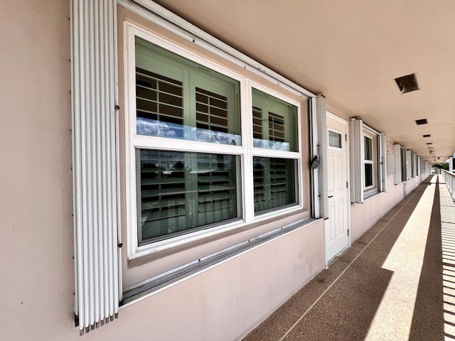 view of side of property featuring a balcony