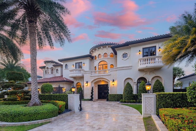 mediterranean / spanish-style house with a balcony