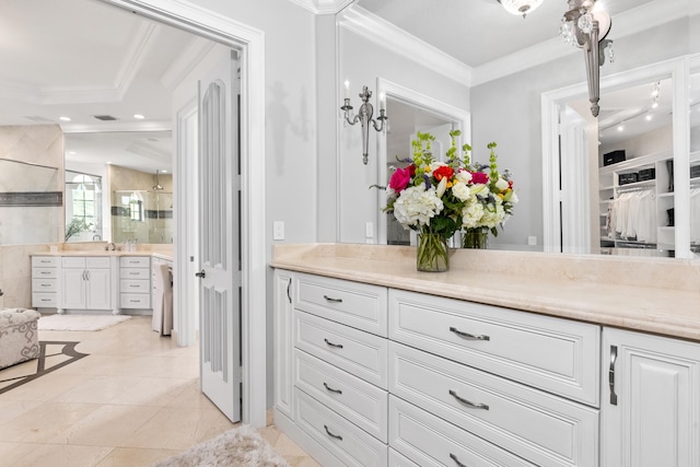 bathroom with ornamental molding, vanity, and tile patterned floors