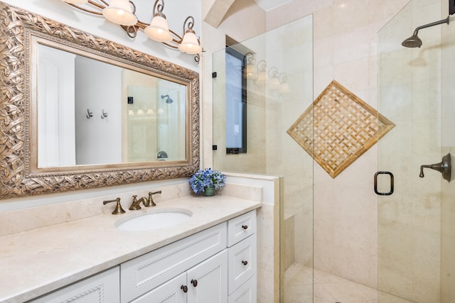 bathroom with vanity and an enclosed shower