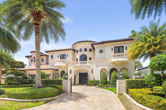 mediterranean / spanish-style house with a balcony