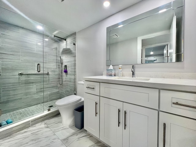 bathroom featuring tile patterned floors, vanity, an enclosed shower, and toilet