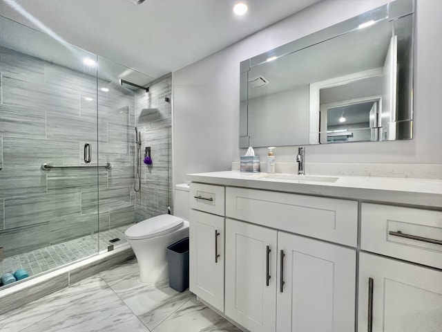 full bathroom featuring a stall shower, marble finish floor, vanity, and toilet