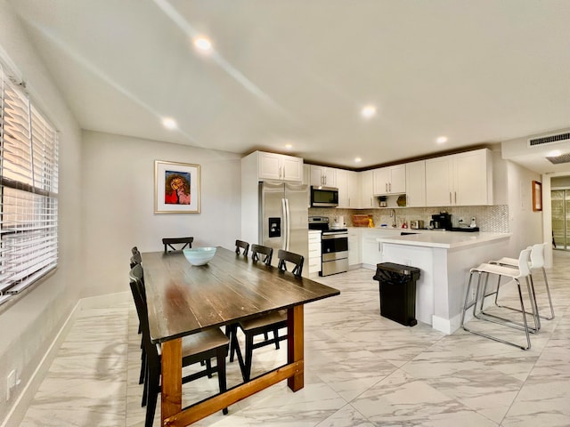 dining room featuring light tile patterned flooring