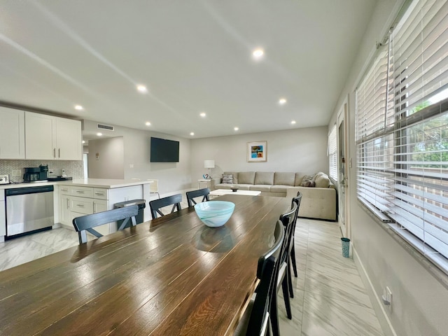 dining space with light tile patterned floors