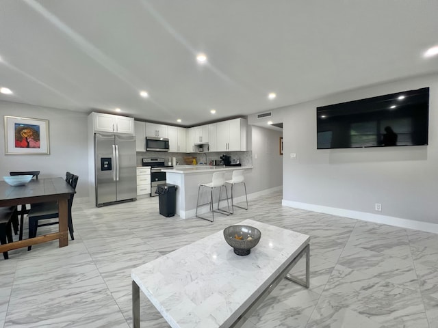 tiled living room featuring sink