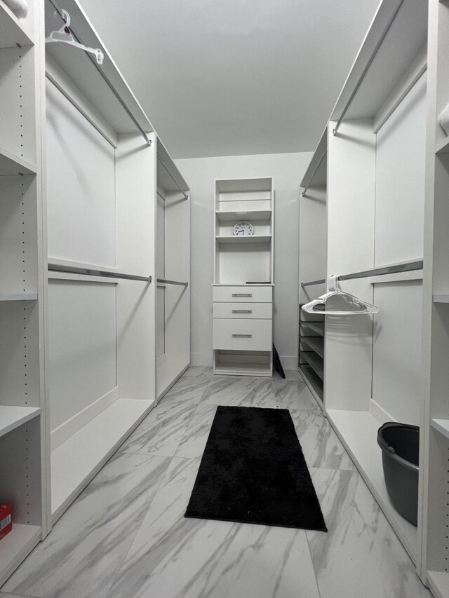 walk in closet featuring light tile patterned floors