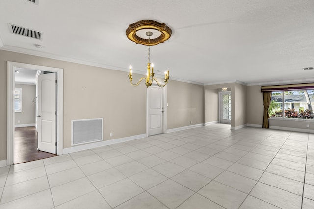 spare room with crown molding, an inviting chandelier, and light tile patterned floors