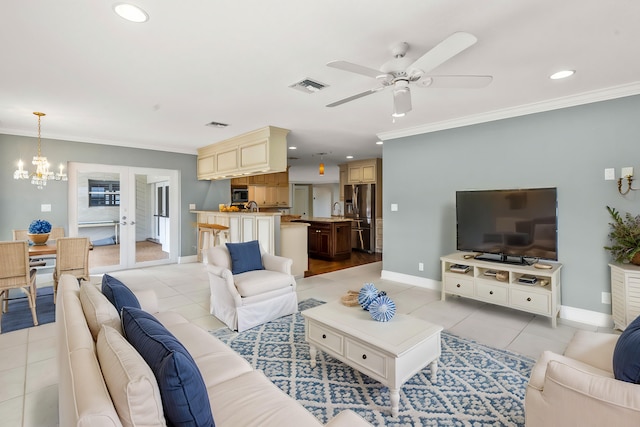 tiled living room featuring ceiling fan with notable chandelier and ornamental molding