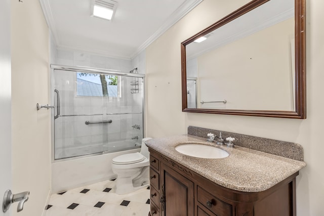 full bathroom featuring vanity, crown molding, enclosed tub / shower combo, and toilet