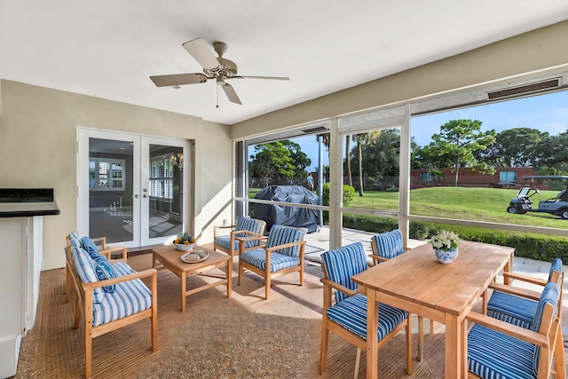 sunroom with french doors and ceiling fan