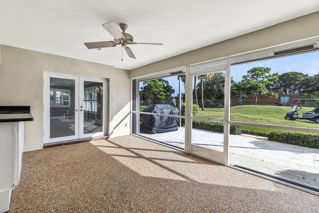 interior space featuring ceiling fan and french doors