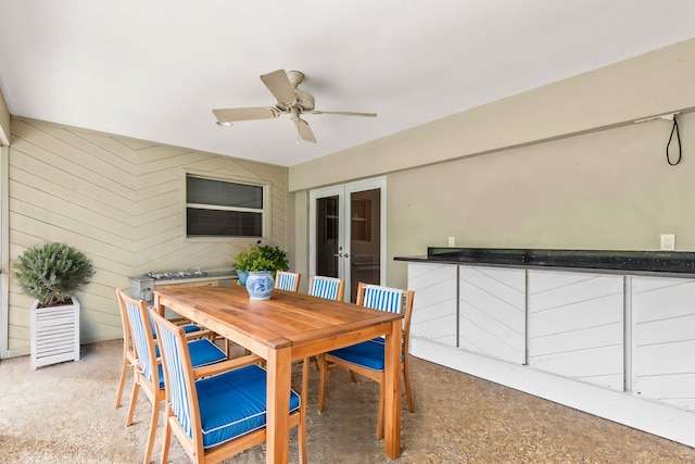 dining space with french doors and ceiling fan