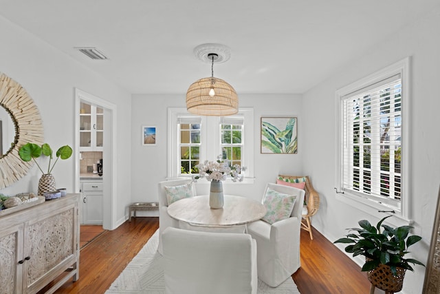 dining room featuring hardwood / wood-style floors and a wealth of natural light