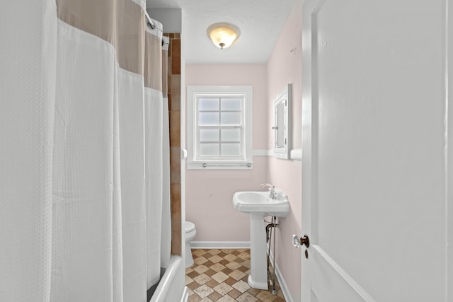 full bathroom with sink, tile patterned floors, shower / bath combo, and toilet