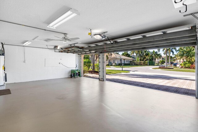 empty room featuring light colored carpet, visible vents, a ceiling fan, a textured ceiling, and baseboards