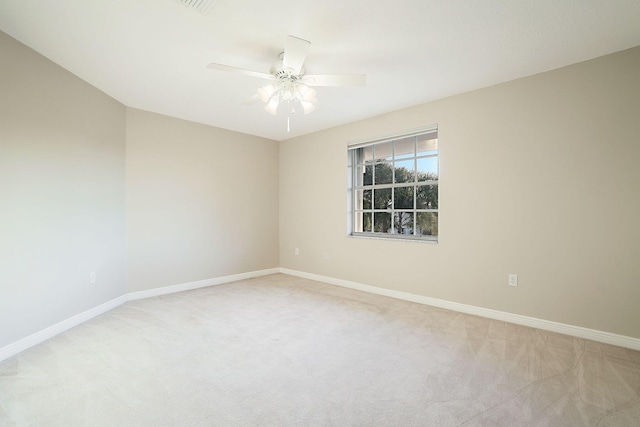 unfurnished room with light carpet, baseboards, and ceiling fan