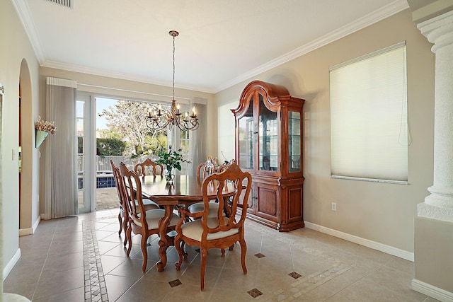 dining space featuring crown molding, light tile patterned floors, baseboards, arched walkways, and a notable chandelier