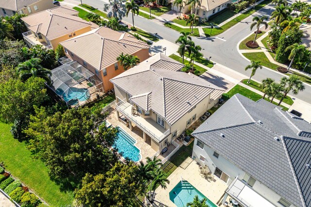 community pool with a patio area and fence