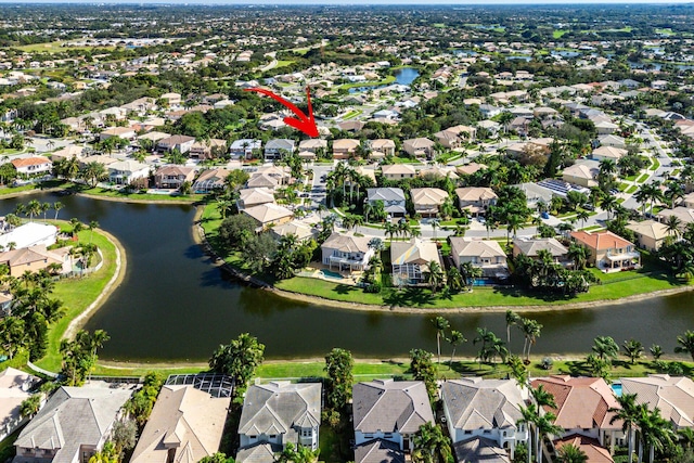 aerial view featuring a residential view and a water view