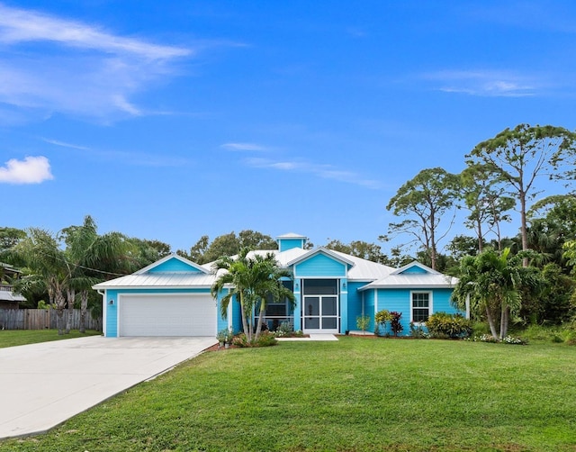 ranch-style home with a front lawn and a garage