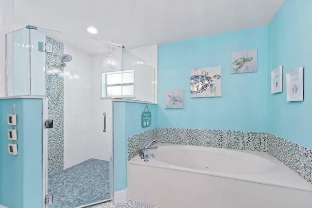 bathroom with separate shower and tub