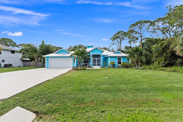 ranch-style home with a garage and a front yard