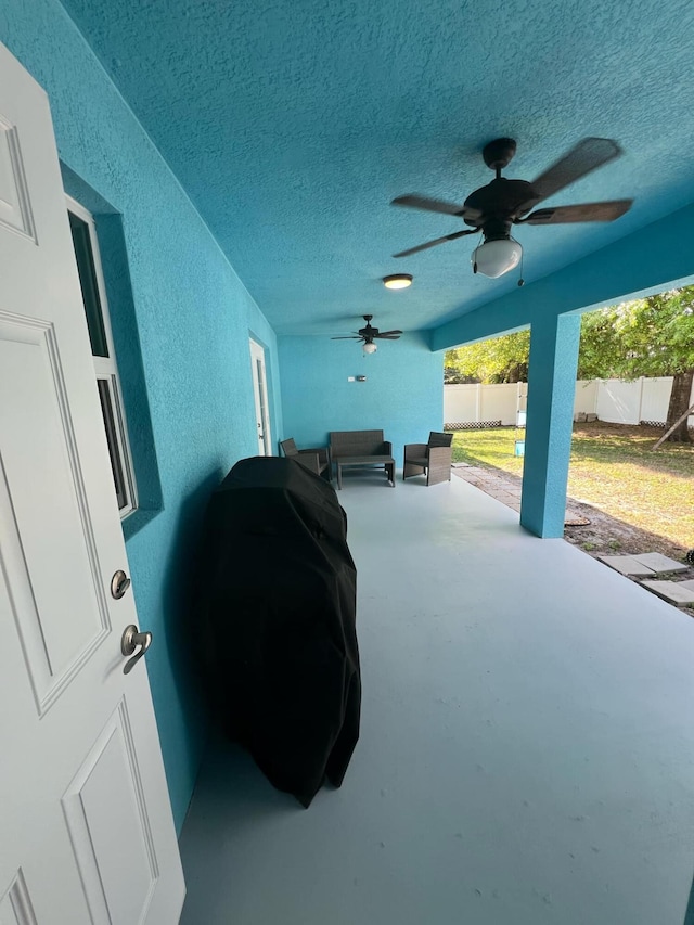 view of patio / terrace featuring ceiling fan