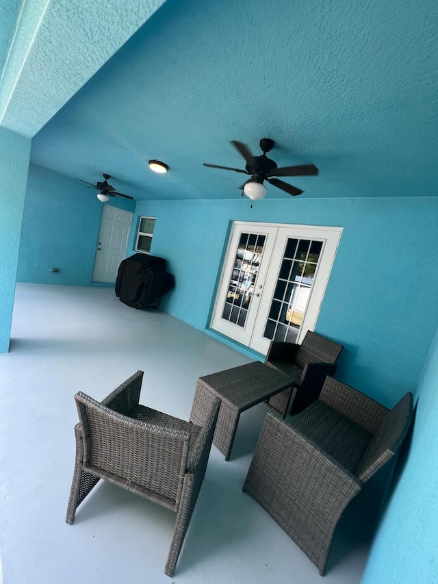 view of patio / terrace featuring area for grilling, ceiling fan, and french doors