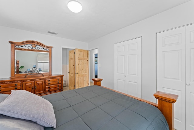 bedroom with multiple closets