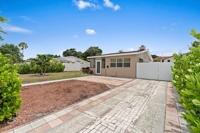 back of property with a patio area