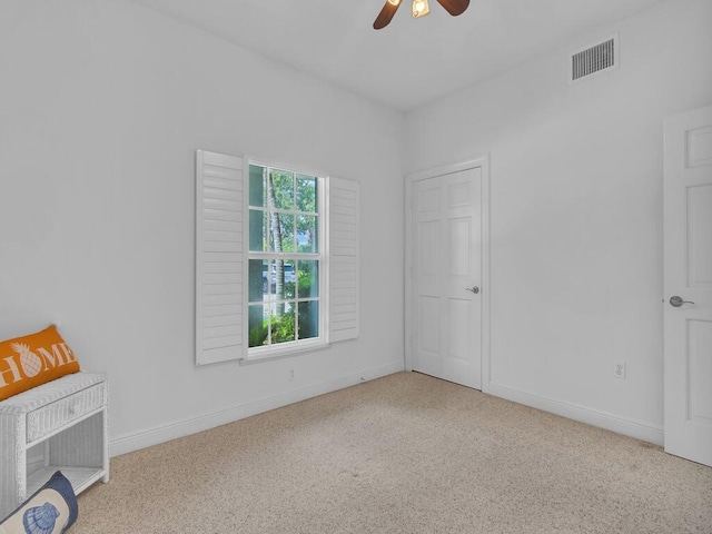 unfurnished room with ceiling fan