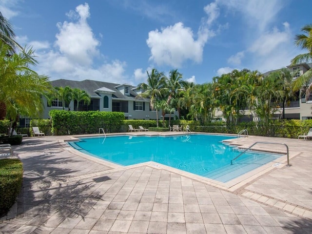 view of swimming pool with a patio