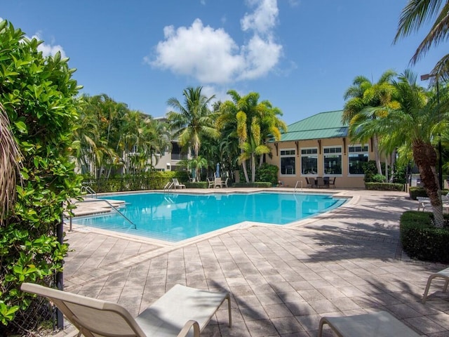 view of swimming pool with a patio