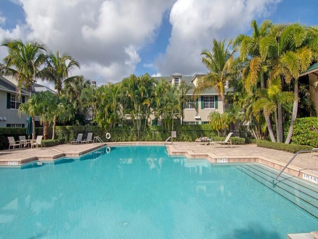 view of swimming pool featuring a patio area