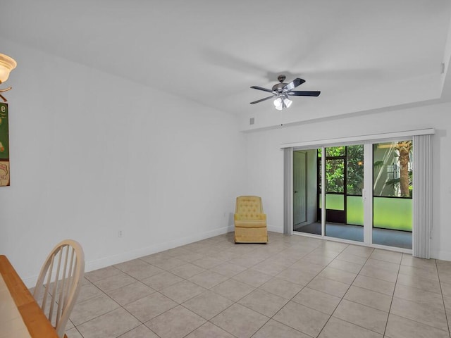 unfurnished room featuring ceiling fan and light tile patterned floors