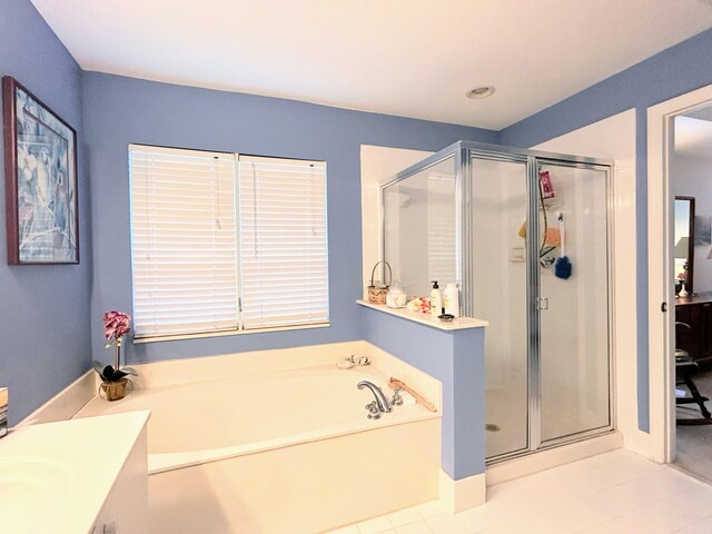 bathroom with vanity, shower with separate bathtub, and tile patterned floors