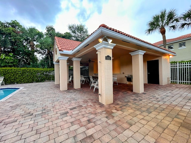 view of patio featuring ceiling fan